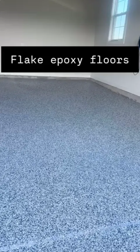 Blue-gray flake epoxy floor in an empty garage